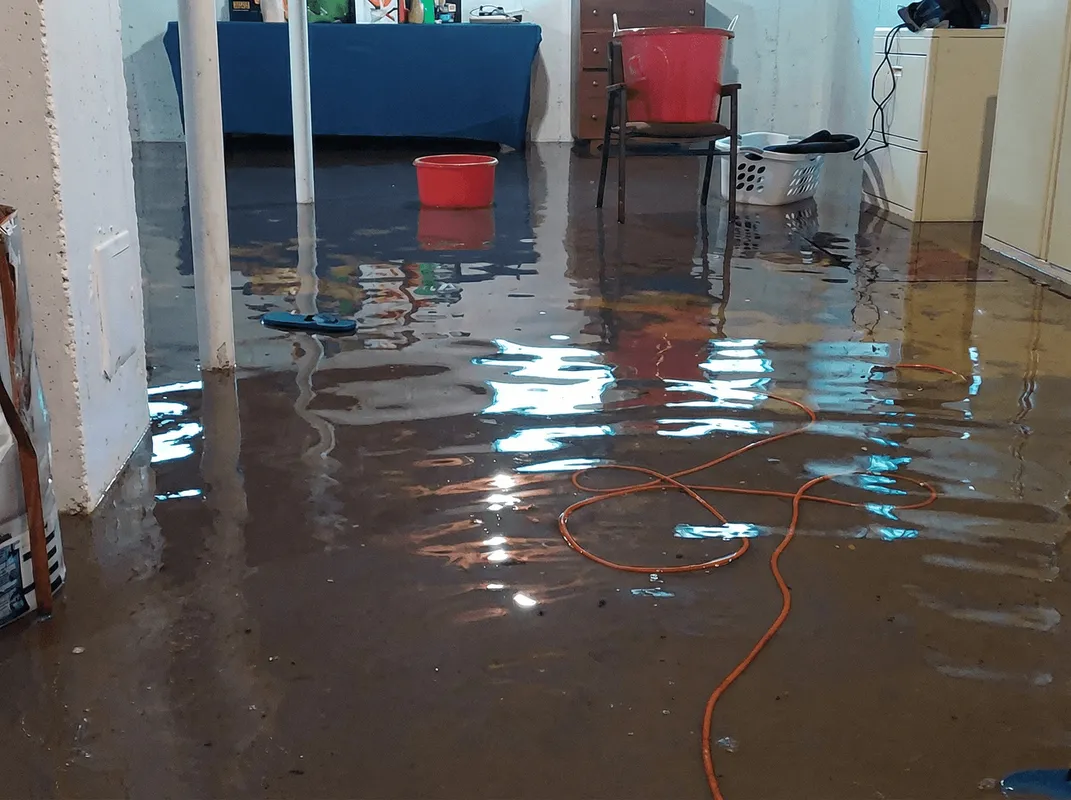 Basement with boiler, cabinets and washing machine completely flooded in Fargo, ND